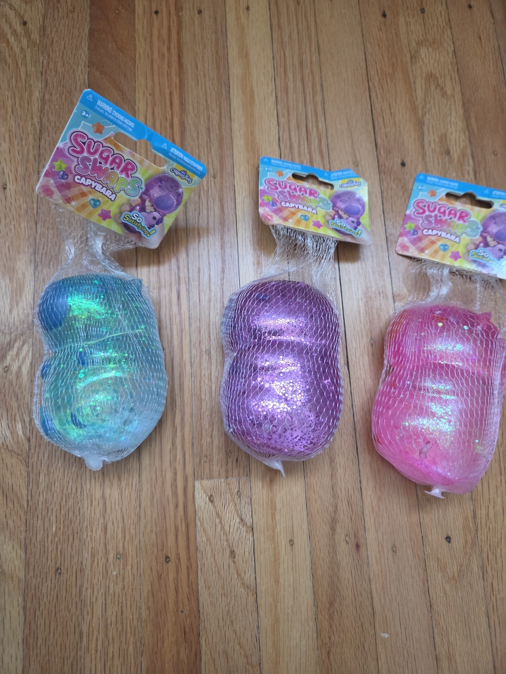 Sugar Swaps Capybara Shimmer Squishies - Blue, Purple, Pink